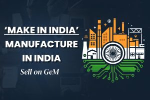An image of a factory with an Indian flag and the words "Make in India" on a blue background. There is also text in Devanagari script below the English text.